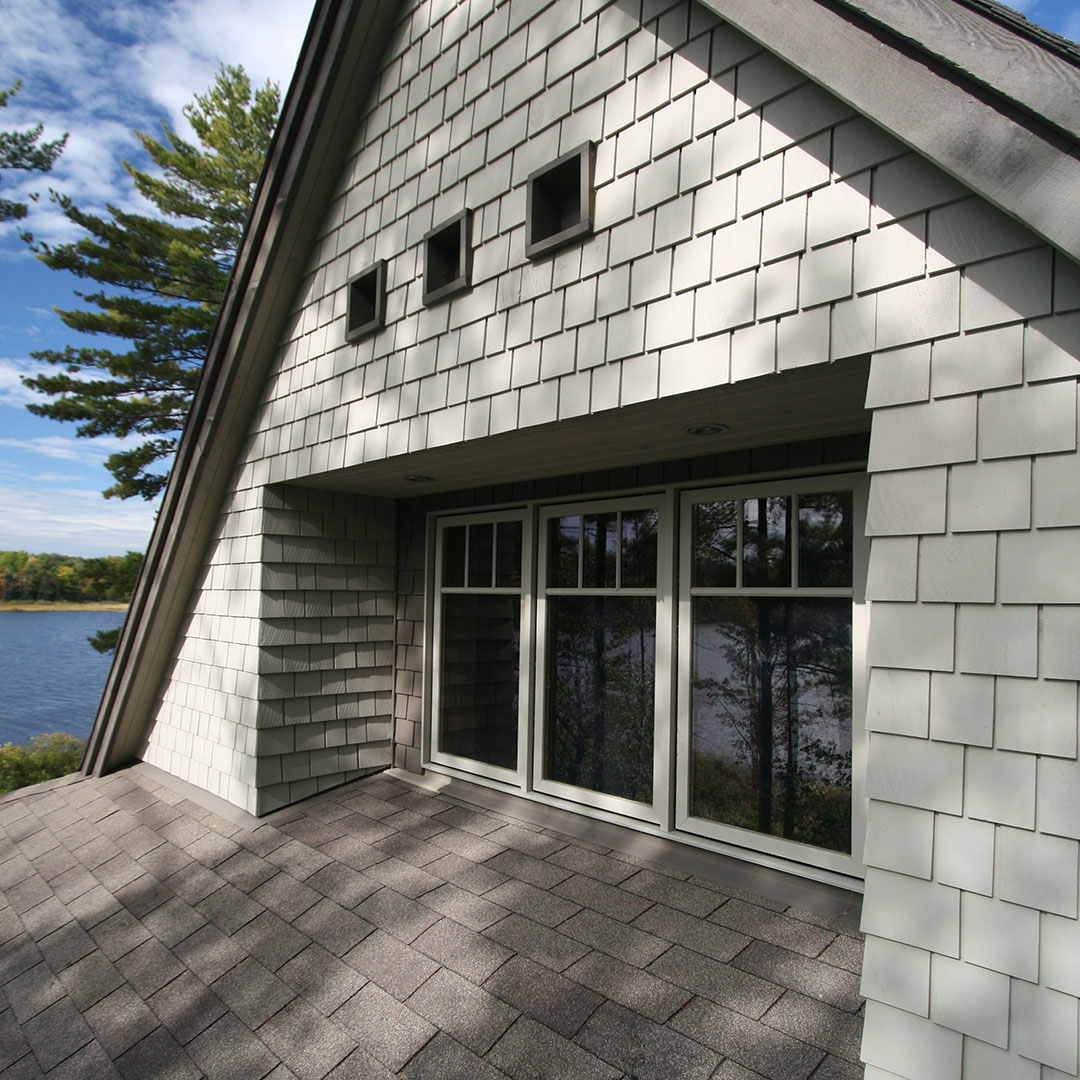architect designed lakefront home - muskoka - recessed windows upper gable